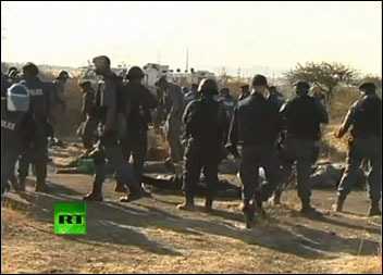 Police open fire on South African miners, dozens killed , RT video still Police open fire on South African miners, dozens killed , RT video still