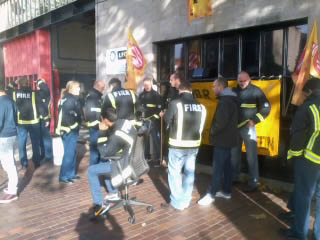 Bow fire station pickets listening to LBC radio reports on the strike, photo by N Byron Bow fire station pickets listening to LBC radio reports on the strike, photo by N Byron