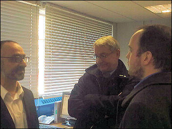 The raid on Greenwich Unison offices. Onay Kasab (on left) is told to 'disappear' The raid on Greenwich Unison offices. Onay Kasab (on left) is told to 'disappear'