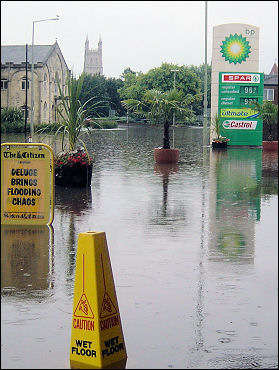 Caution wet floor - flooding in the centre of Gloucester, photo Chris Moore Caution wet floor - flooding in the centre of Gloucester, photo Chris Moore