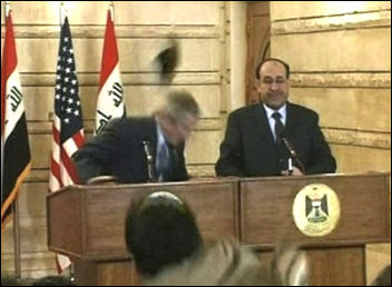 US President George W Bush humiliated by shoe attack