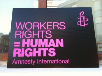 Placard at Amnesty International, 10.10.12  , photo Judy Beishon