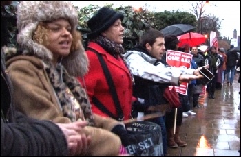 Saturday 24 November, defying cold driving rain, up to 10,000 residents and staff marched to defend Lewisham Accident and Emergency (A&E) and linked arms around it., photo Socialist Party