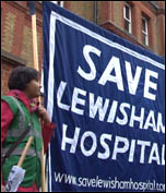 Save Lewisham Hospital demonstration: Saturday 24 November, defying cold driving rain, up to 10,000 residents and staff marched to defend Lewisham Accident and Emergency (A&E) and linked arms around it. , photo Socialist Party
