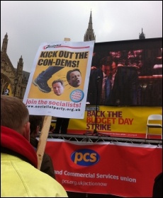 PCS stage outside parliament, and screen showing Budget speech, photo by Sarah Sachs Eldridge