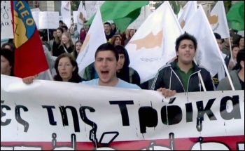 Cyprus workers protest against the Cypriot government's deal with the Troika - the IMF, Central bank and the EU, photo AFPTV J. Massad