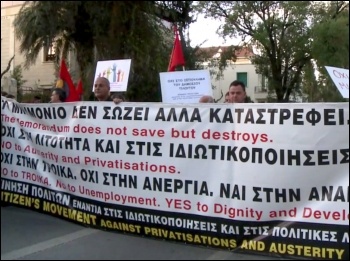Cyprus workers protest against the Cypriot government's deal with the Troika - the IMF, Central bank and the EU, photo AFPTV J. Massad