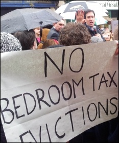 Ed Miliband avoids protesters against the Bedroom tax, photo by Chris Moore