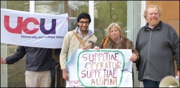 Socialist Students member Farid Norat with a Latin banner ('support the workers, support the students' ), next to the Unison secretary and a UCU committee member 