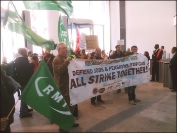 ISS cleaners on the East Coast  mainline on strike, Kings Cross, with NSSN supporting, 16.9.13, photo by Chris Newby