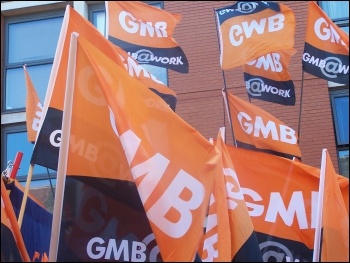 GMB flags at the TUC demo in Manchester: 50,000 march against Tories demanding action on NHS, photo Claire Job