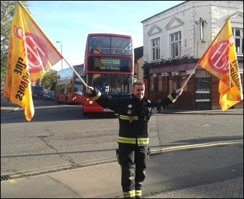 A picketer at Leyton fire station, London, photo by Sarah Wrack