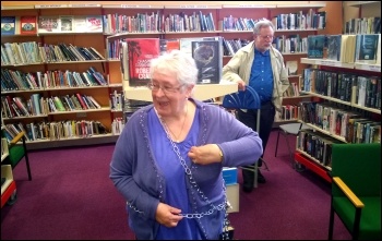 Chaining to the bookshelves, Rhydyfelin library, 31.5.14, photo by D Reid Chaining to the bookshelves, Rhydyfelin library, 31.5.14, photo by D Reid