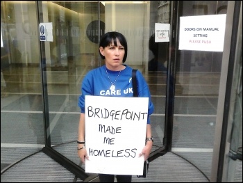 Mags Dalton, made homeless by Care UK pay cuts, protests outside Bridgepoint office in London, 08.08.2014