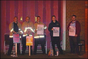 Firefighters picketing at Bromborough fire station in Merseyside during the 9-16 August round of strikes over pension cuts