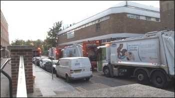 Refuse collectors parked their lorries in a long line outside the town hall , photo by P Mason
