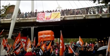 GMB contingent marches under the Socialism 2014 banner on Jubilee bridge, photo by Dave Reid