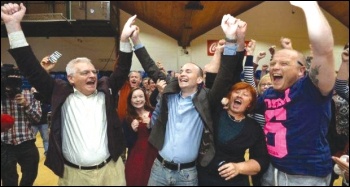 Joe Higgins (left) and Paul Murphy (centre) celebrate the October 2014 byelection victory