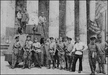 Bolsheviks with one of the armored cars that quelled the White uprising.