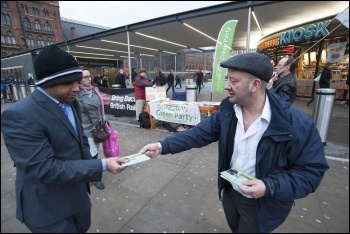 Green Party campaigners outside London's King's Cross station, photo Paul Mattsson
