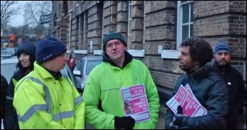 TUSC prospective parliamentary candidates Glyn Robbins (centre) and Hugo Pierre (right) supporting the Bow garage picket, photo N Byron 