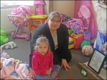 Laura Sharpe and her daughter in their 'temporary' home in Ilford