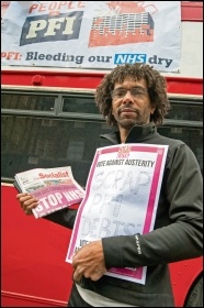 TUSC candidate Hugo Pierre with the anti-PFI bus, photo Paul Mattsson TUSC candidate Hugo Pierre with the anti-PFI bus, photo Paul Mattsson