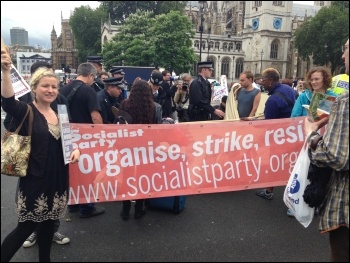 Socialist Party members join in blocking the road with DPAC, London, 8.7.15, photo by Paula Mitchell