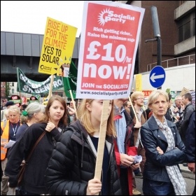 £10/hour Now placard on the People's Assembly demo, 20.6.15, photo by Judy Beishon