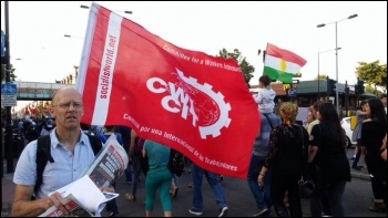 CWI flag (Committee for a Workers' International) on the demo, 21.7.15