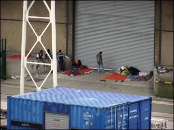 Migrants at Calais in previous years, photo by Tom Jervis (Creative Commons)