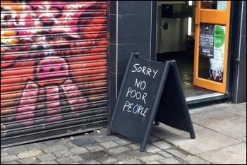 'Sorry no poor people' sign outside Brick Lane Coffee, photo Facebook 'Sorry no poor people' sign outside Brick Lane Coffee, photo Facebook