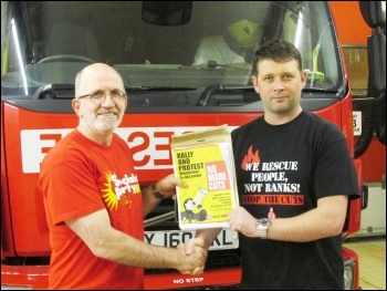 Bernard Davies, Selby Socialist Party secretary, handing over a petition  to Steve Howley, North Yorkshire FBU secretary, photo by Selby Socialist Party