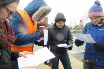 Gateshead, 9.3.16, reading the Socialist Party leaflet, photo by E Brunskill