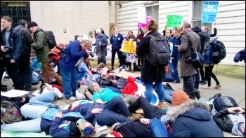 'Die-in' outside the Department of Health (and the NHS choir - standing), London. photo by Paula Mitchell