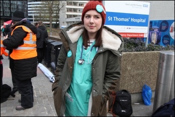 A striking junior doctor outside St Thomas' Hospital, south London, 26.4.2016, photo by Senan