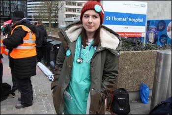 A striking junior doctor outside St Thomas' Hospital, south London, 26.4.2016, photo by Senan A striking junior doctor outside St Thomas' Hospital, south London, 26.4.2016, photo by Senan