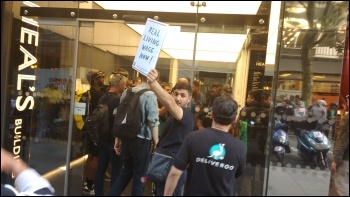 A Deliveroo workers' delegation enters the company HQ for talks with management photo James Ivens