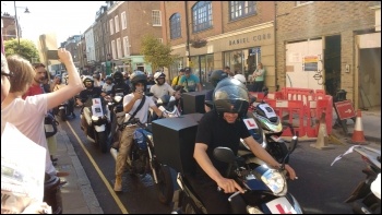 UberEats workers ride into town to face down their bosses photo Scott Jones