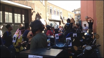 UberEats drivers protest outside the company's offices photo Scott Jones