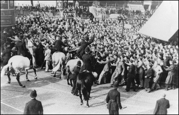 Anti-fascist workers clash with police at Cable Street