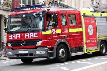 Over 200 firefighters, local residents, anti-cuts campaigners and their families protested the council's plans to close Staines fire station