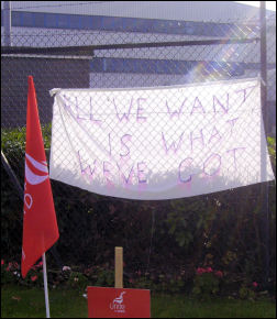 A banner on the Superdrug picket line, photo Alistair Tice