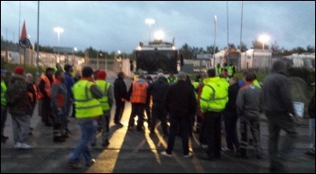 About 50 workers on the picket line on 17 October block lorries coming out of the yard photo Philip King