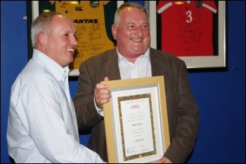 Bernard (right) being honoured at his retirement party in 2010 by CWU deputy general secretary Tony Kearns