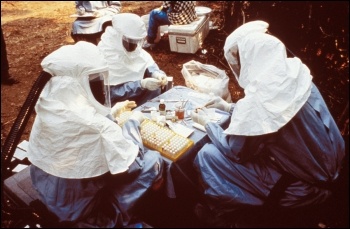 Ebola scientists testing samples, photo by US Centers for Disease Control and Prevention