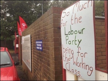 A placard tied to the gates by striking Birmingham binworkers in 2018