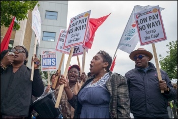 Outsourced NHS workers in east London on strike against poverty pay in 2017, photo Paul Mattsson