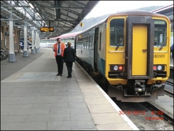 Train guard at Swansea station photo Lobster1/CC, photo Lobster1/CC