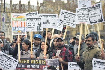 Refugee Rights campaigners marching, photo by Mary Finch